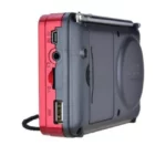 Radio sans fil JOC H011BT rouge utilisée à la maison via Bluetooth.